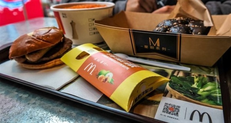 Customers order lunch during breakfast hours at McDonald's